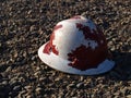 Hard Hat lying on gravel Royalty Free Stock Photo