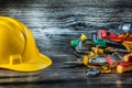 Construction helmet and set of tools on vintage wood Royalty Free Stock Photo