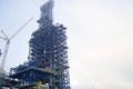 Construction with the help of cranes of a large chemical installation at an oil refinery