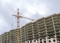 Construction of a high-rise building with a crane Royalty Free Stock Photo