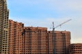 Construction of a high-rise building with a crane. The construction crane and the sky Construction of a high-end residential Royalty Free Stock Photo