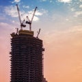 Construction of high-rise building. Construction cranes and skyscraper Royalty Free Stock Photo