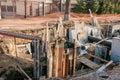 Construction of a high-rise building. Pouring of foundation columns with concrete Royalty Free Stock Photo