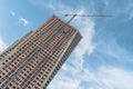 Construction activity of high-rise buildings in the city with turret slewing crane in daytime Royalty Free Stock Photo