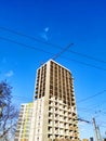 Construction of high-rise buildings in Ivano-Frankivsk. Construction crane. Building against the blue sky Royalty Free Stock Photo