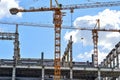 Construction of high-rise buildings, the supply of building materials with the help of a crane Royalty Free Stock Photo