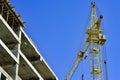 The construction of high-rise buildings, the supply of building materials with the help of a crane Royalty Free Stock Photo