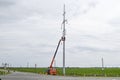 Construction of a high-voltage power line. Assembly and installation of new support of a power line