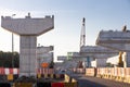 Construction of highway overpass bridge infrastructure in progress with morning sun rays Royalty Free Stock Photo