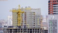 Construction of the house with a crane and people