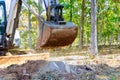 During construction of a house, lot of ground preparation work is taking place using an excavator Royalty Free Stock Photo