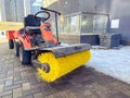 Construction of houses. cleaning with the help of a special car with a huge brush for cleaning asphalt. a driver control car