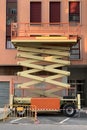 Construction hydraulic lift near a residential building