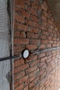construction and improvement of a new home, black electrical wires are connected in a white junction box in a brick wall without Royalty Free Stock Photo