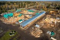 Construction industry concept. Timber wooden frame of house from bar, foundations of villas. Aerial top view Royalty Free Stock Photo