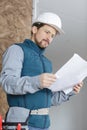 construction industry engineer eading paper plans