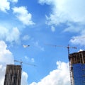 Construction industry image of tall cranes and building exterior Royalty Free Stock Photo