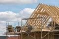 Construction industry. Timber framework of house roof trusses wi Royalty Free Stock Photo