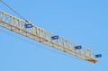 Construction industry tower crane against clear blue sky Royalty Free Stock Photo