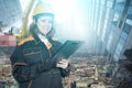 Construction inspection, construction and design,builder in hardhat at construction site,woman engineer worker with clipboard Royalty Free Stock Photo