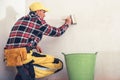 Construction Interior Finishing Worker Priming Wall with Large Painting Brush Royalty Free Stock Photo