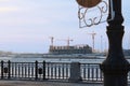 Construction of an international cable car terminal in Heihe, China. View from the embankment of the Amur River in the