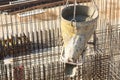 Construction of a large commercial building. Cement supply on the background of a construction site with associated armature.