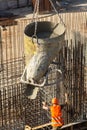 Construction of a large commercial building. Worker takes cement for pouring reinforcement at the construction site.