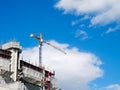 Construction large crane under blue sky in summer evening