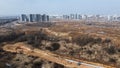 Construction of a large residential area. The construction site is visible. Multi-storey buildings and infrastructure under constr