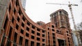 The construction of a large round brick building