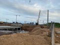 Construction of a large underground infrastructure industrial facility with a foundation using powerful construction cranes