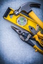 Construction level claw hammer steel cutter pliers Royalty Free Stock Photo