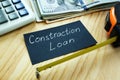 Construction loan concept. Measuring tape and money