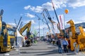 Construction machinery and equipment fair Bauma CCT Russia. Outdoor exhibition with trucks, cranes, excavators and other