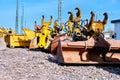 Construction machinery, excavator shovels are stored on the edge of a construction site Royalty Free Stock Photo