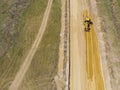 Construction machinery makes a new road in the field Royalty Free Stock Photo