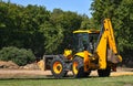 Construction machinery tractor with bucket and excavator Royalty Free Stock Photo