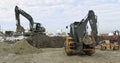 Construction Machinery At Work On Building A House. Different Types Of Tractors And Excavators Prepare The Soil For