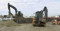 Construction Machinery At Work On Building A House. Different Types Of Tractors And Excavators Prepare The Soil For