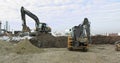 Construction Machinery At Work On Building A House. Different Types Of Tractors And Excavators Prepare The Soil For