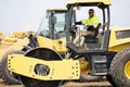 construction machinery worker at roller. machinery in a manufacturing industry with construction worker outdoor