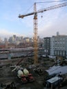 Construction machines, Cranes,  and Cement trucks works at High-rise Construction site Royalty Free Stock Photo