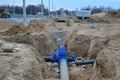 Construction of main water supply pipeline. Laying underground storm sewers at construction site, water main, sanitary sewer,