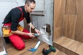 Construction man using hammer and tool while demolish wall Royalty Free Stock Photo