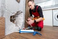 Construction man using hammer and tool while demolish wall Royalty Free Stock Photo