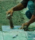 Construction man worker floor tile installation. Royalty Free Stock Photo