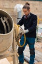 Construction man worker making concrete in the cement mixer at construction site Royalty Free Stock Photo