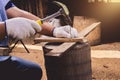 Construction man workers in blue shirt with Protective gloves working with hammer Royalty Free Stock Photo