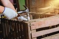 Construction man workers in blue shirt with Protective gloves working with hammer Royalty Free Stock Photo